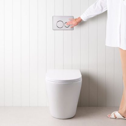 Angled In-Wall Toilet With Round Chrome Buttons