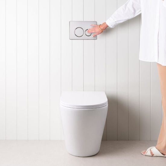 Angled In-Wall Toilet With Round Chrome Buttons