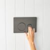 Angled In-Wall Toilet With Round Gunmetal Buttons