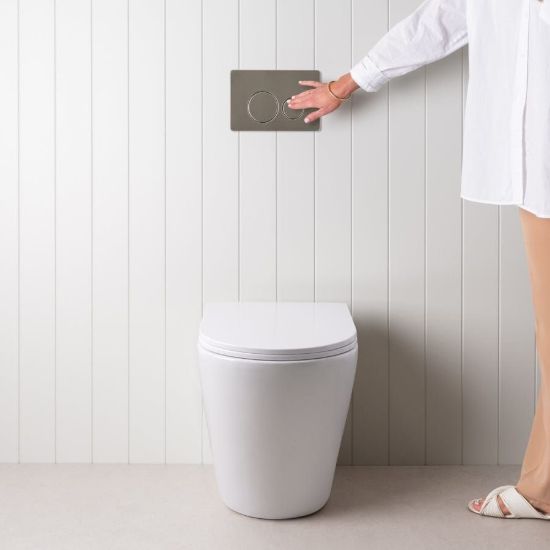 Angled In-Wall Toilet With Round Stainless Steel Buttons