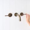 Melbourne Wall Spout + Double Handle Taps Antique Brass