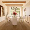 Modern 71" Oval Whitewash Faux Travertine Dining Table with Fluted Base & Storage