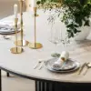 Aura 47" Round Black Faux Travertine Sintered Stone Dining Table, Fluted Base, Seats 4