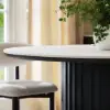 Aura 47" Round Black Faux Travertine Sintered Stone Dining Table, Fluted Base, Seats 4