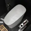 47" Japanese-style irregular freestanding stone resin soaking bathtub, marble effect