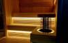 Picture of Dark Grey Solid Wood Sauna Room with Sliding Door and Tiered Seating, Modern Commercial Design