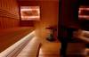 Picture of Dark Grey Solid Wood Sauna Room with Sliding Door and Tiered Seating, Modern Commercial Design